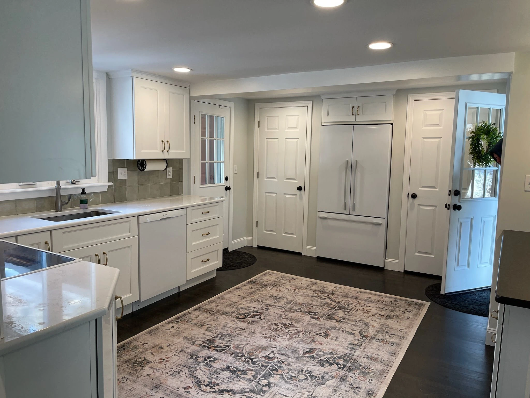 Lagace Construction team installing custom kitchen cabinetry